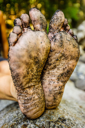 Dirty feet of a trekker resting next to the Cinqueta river, GistaÃ­n Valley, Aragonese Pyrenees, Huesca, Spain.の写真素材