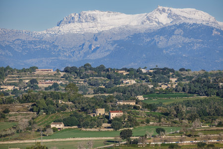 Snow-capped Puig Major seen from the cultivated fields of Montuiri, Majorca, Balearic Islands, Spainの写真素材