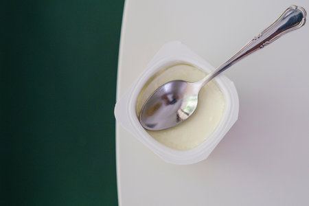 natural yogurt and teaspoon, Majorca, Balearic Islands, Spainの写真素材