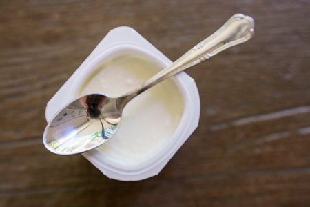 natural yogurt and teaspoon, Majorca, Balearic Islands, Spainの写真素材