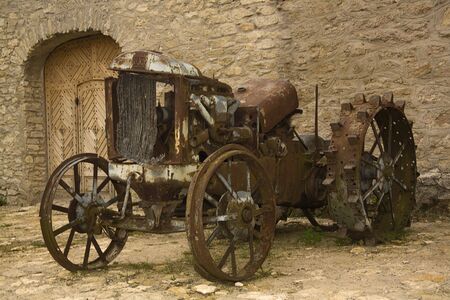 Old Machinery. Retro wheeled tractor on neglectedfarmの写真素材