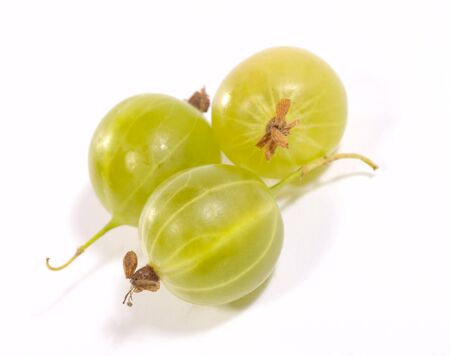 few gooseberries on bright background with shadows. Is not isolated imageの写真素材