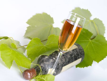 Old  wine still-life. Bottle and glass with grape vineの写真素材