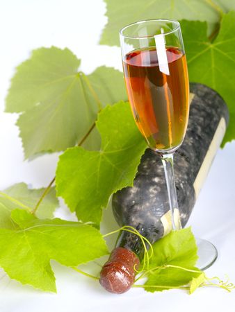 Old  wine still-life. Bottle and glass with grape vineの写真素材