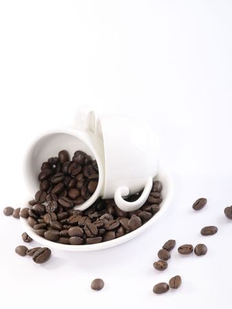 Two cup of coffee on the plate with beans. Is not isolated imageの写真素材