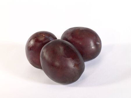 fresh ripe plum with drop shadow. is not isolatedの写真素材
