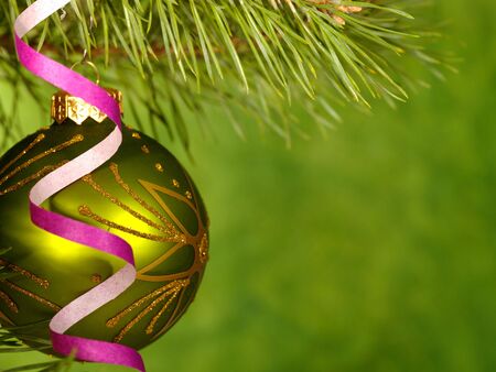Xmas green ball on the green background.の写真素材