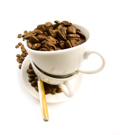 Pair coffee cup on the plate with spoon and coffee beansの写真素材