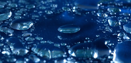 water droplets over the glass backgroundの写真素材