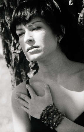 beauty adult brunette portrait. scanned film source, film grain saved as art elementの写真素材