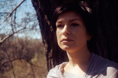 beauty adult brunette portrait. scanned film source, film grain saved as art elementの写真素材