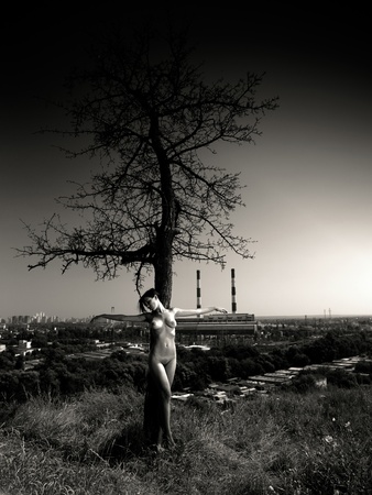 loneliness in the city. urban scene with naked girlの写真素材