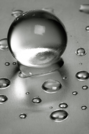 Abstract still-life. Water droplets over steel surfaceの写真素材