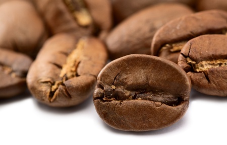 coffee beans closeup over white backgroundsの写真素材