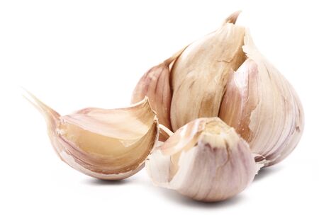closeup of raw dried garlic over white backgroundの写真素材