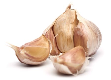 closeup of raw dried garlic over white backgroundの写真素材