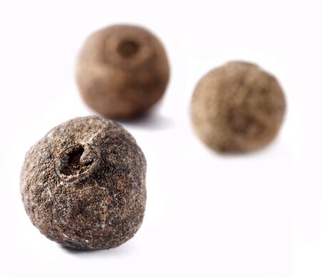 closeup of allspice seed over white backgroundの写真素材