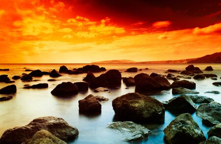 Sunset on the sea  sea coast with slow shutter speedの写真素材