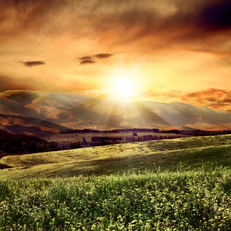 on the evening  rural summer landscape close to high mountainの写真素材