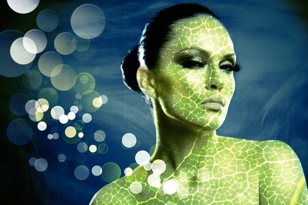 Young beauty woman stylish portrait. Leaf texture addedの写真素材