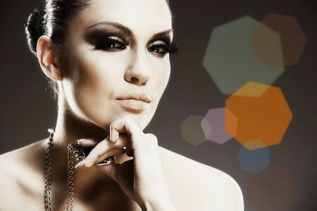 Female portraith with beauty bokeh over brown backgroundsの写真素材