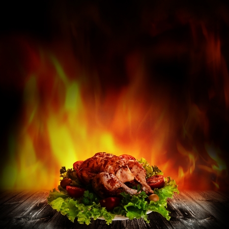 Grilled chicken over salad on the wooden deskの写真素材