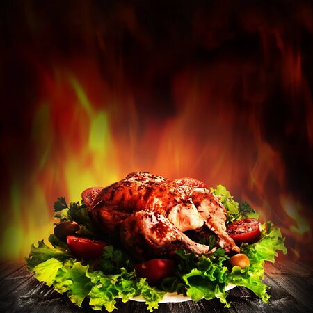 Grilled chicken over salad on the wooden deskの写真素材