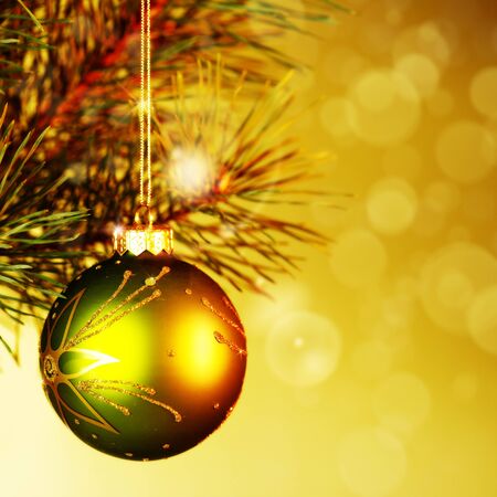 Xmas decoration ball over abstract golden backgrounds with beauty bokehの写真素材