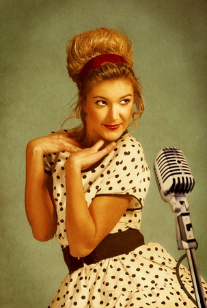 Pretty singer. Grungy female portrait with old paper textureの写真素材
