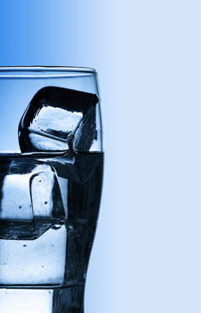 Glass with fresh cool water and iceの写真素材