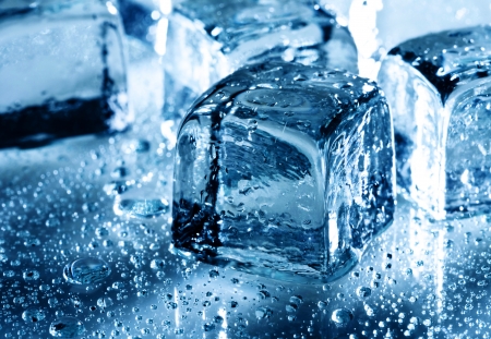 Ice with water droplets over abstract wet backgroundの写真素材