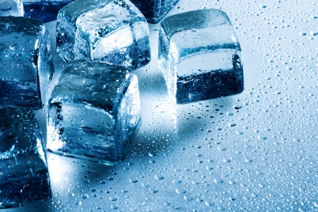 Ice cube and water drops on the wet backgroundの写真素材