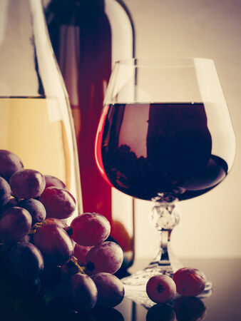 Wine and grape. Winery still life on the glass with reflectionsの写真素材