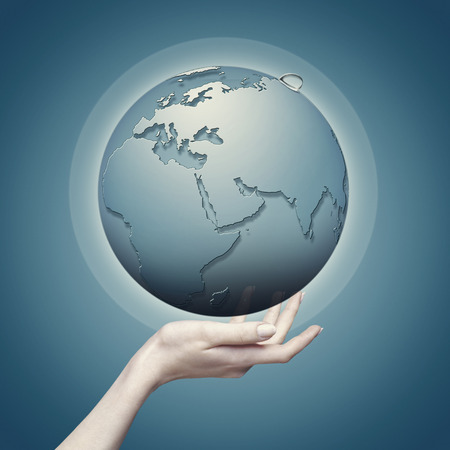 Earth globe into female hand, abstract eco backgroundsの写真素材