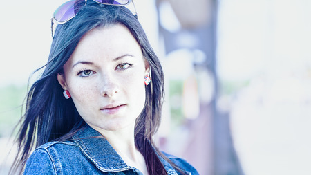 16x9 Urban female portrait over blured bright background