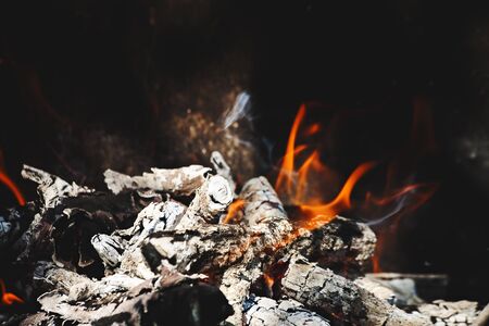 Burning flame and firewoods as abstract backgroundsの写真素材