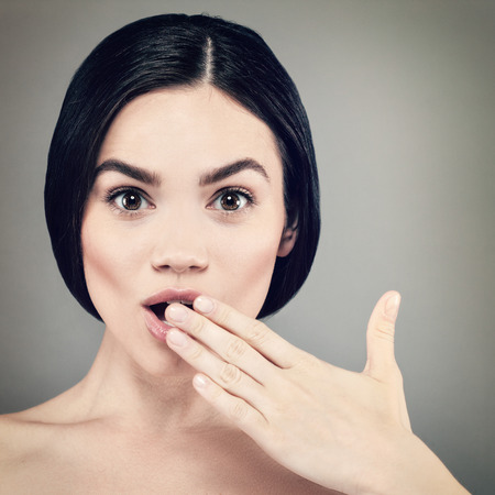 WOW! Beauty female portrait. Shocked girl. Shocking newsの写真素材