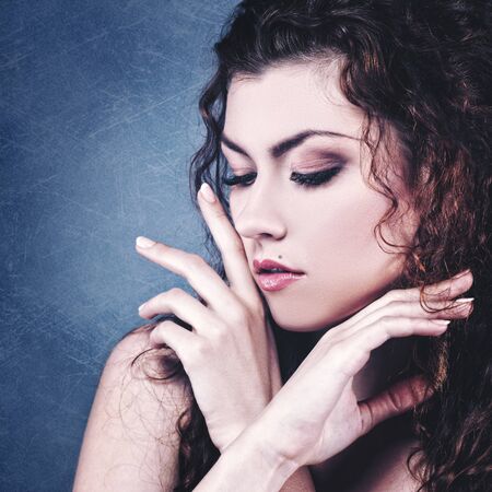 Fashionable female portrait over grungy backgrounds. Vogue vamp style brunette girl.の写真素材