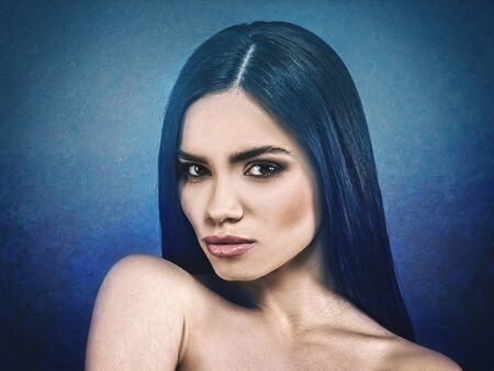 Fashionable female portrait over grungy backgrounds. Vogue vamp style brunette girl.の写真素材
