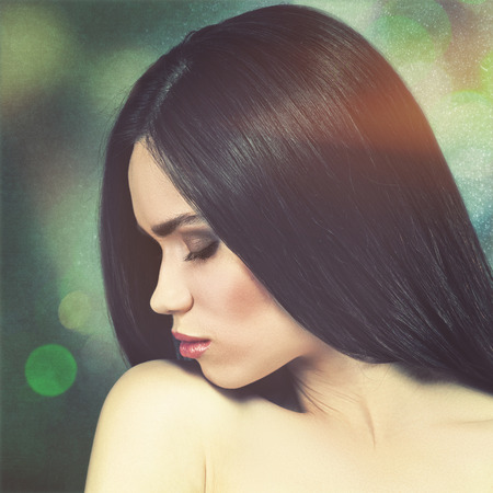 Fashionable female portrait over grungy backgrounds. Vogue vamp style brunette girl.の写真素材