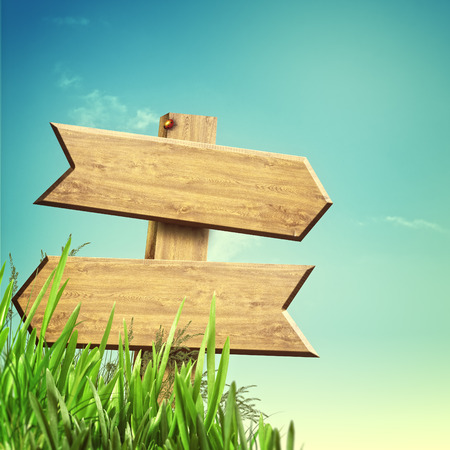 Wooden sign over abstract natural backgroundsの写真素材