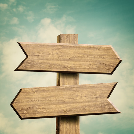 Wooden sign over abstract natural backgroundsの写真素材