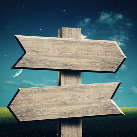 Wooden sign over abstract natural backgroundsの写真素材