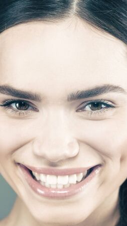 Beauty smile. Attractive young girl smiling. Health bannerの写真素材