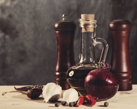 Cuisine still life with olive oil, spices and onionの写真素材