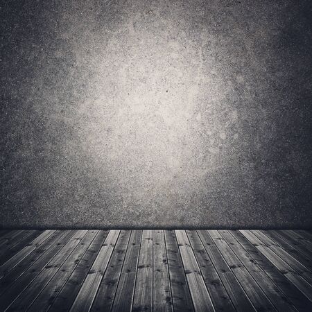 Abandoned old room with concrete wall and wooden floorの写真素材