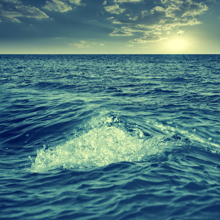 Abstract marine view with ocean waves, water surface and blue skyの写真素材
