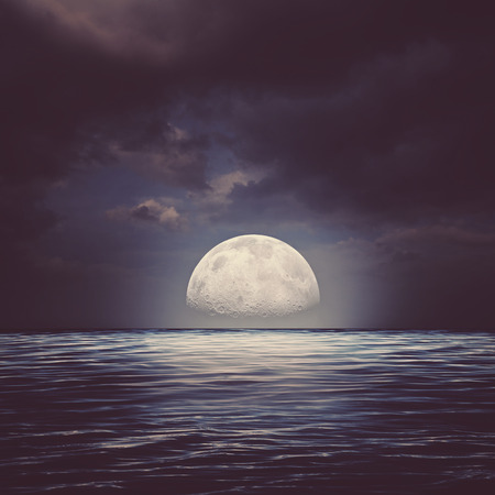 Sea surface under night stormy skies, abstract natural backgroundsの写真素材
