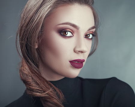 Beautiful blond. Young adult woman studio portraitの写真素材