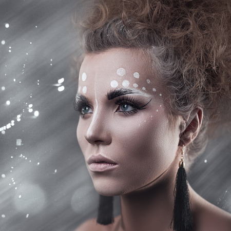 Art makeup. Beauty female portrait with cute make-upの写真素材